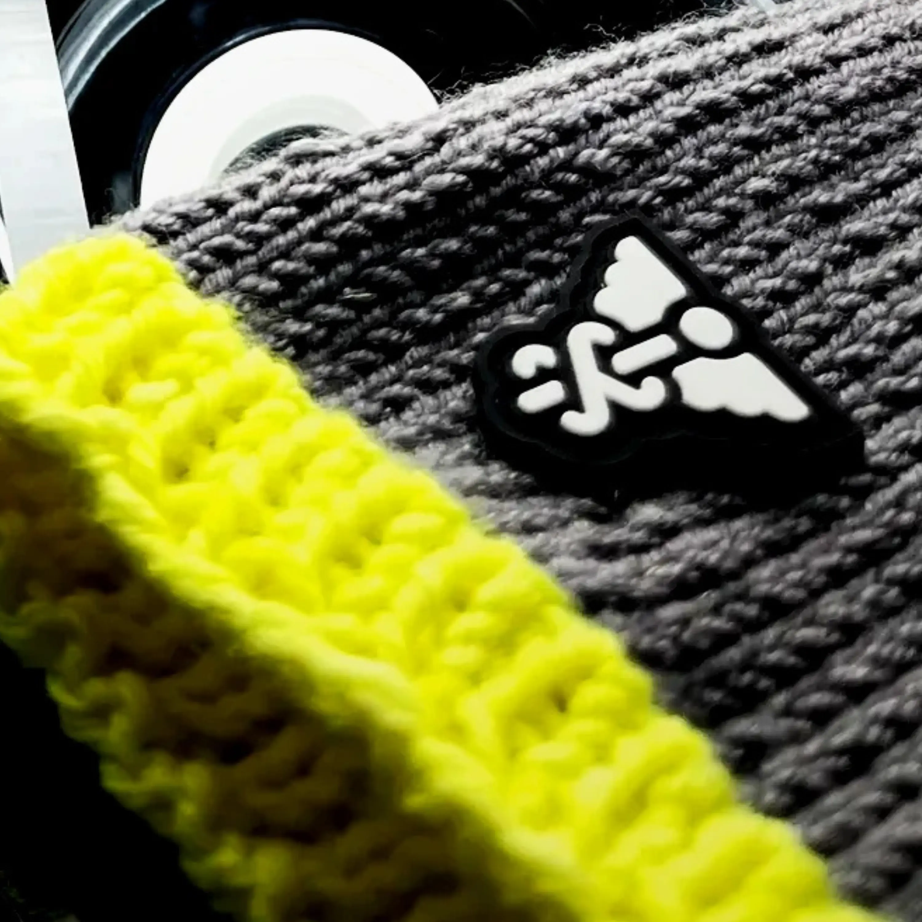 Knit specimen: superfine merino with phosphor trim and embossed symbol patch